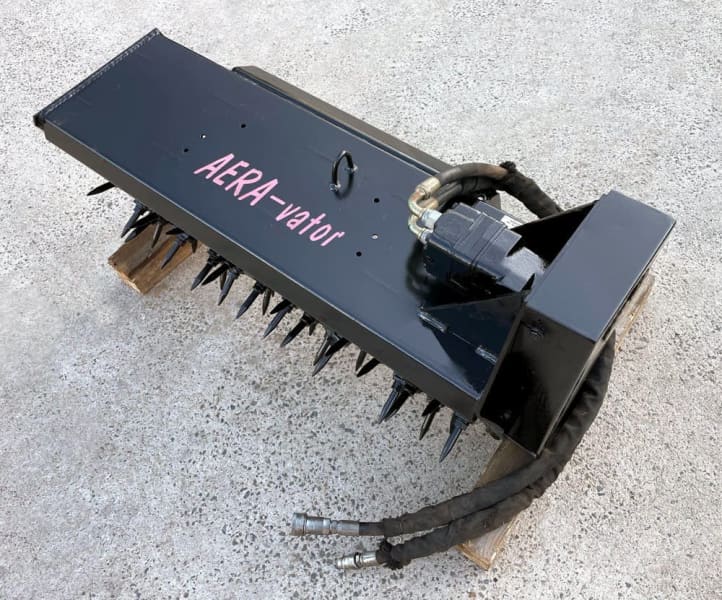 Rent the (Aera vator) Mini Skid Steer/Loader Attachment Cardinal